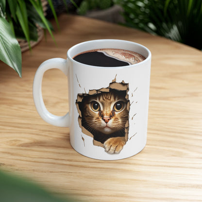 Cute Kitten Looks From Torn Wall Mug